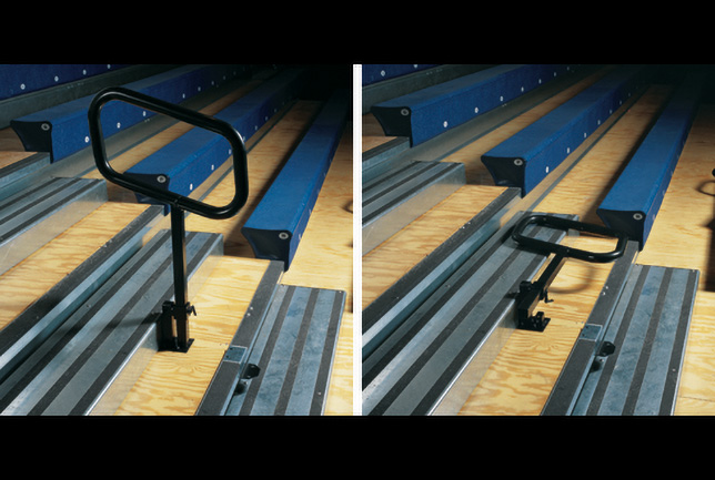 Fold and stow center aisle hand rail