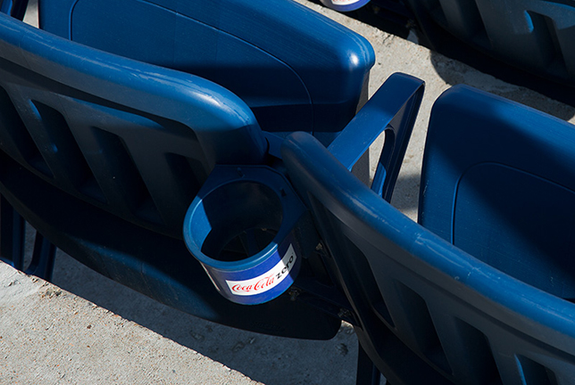 Stadium seat cupholder