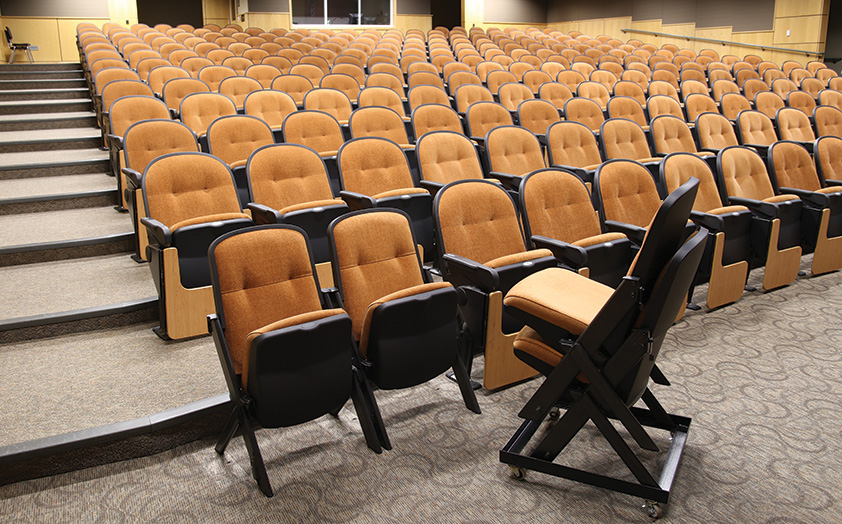 Portable Stacking Quattro chairs in school auditorium